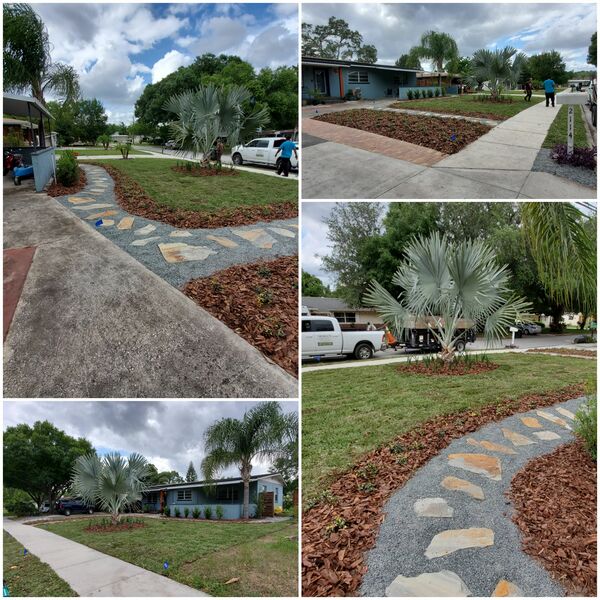 Front yard design with flagstone path through gravel and mulch beds around a blue palm